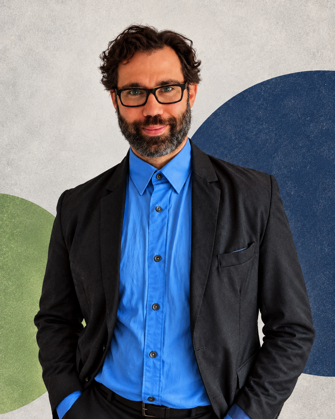 Jason in glasses, a dark blazer and blue shirt